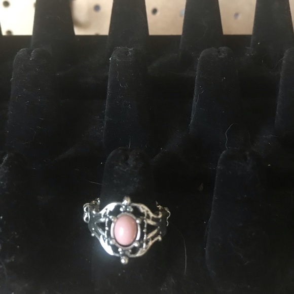 Silver ring w/peachy pink center stone.